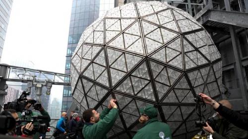 Electricians install Waterford Crystal triangles on the Times Square New Year's Eve Ball atop the roof of One Times Square in the Manhattan borough of New York